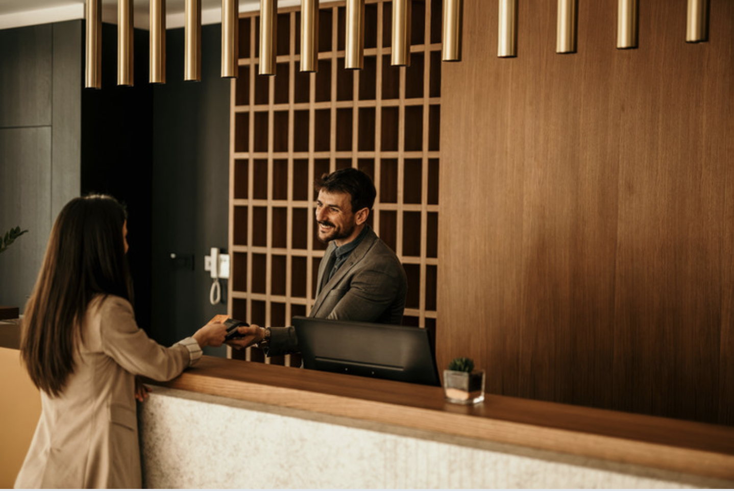 Hotel concierge at reception desk