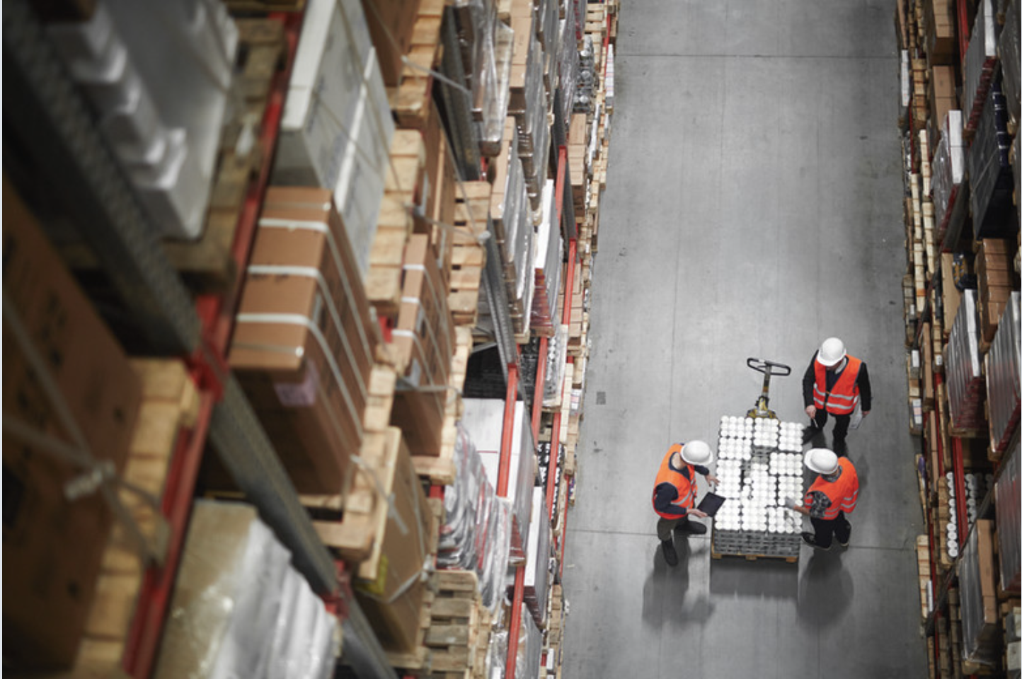 Warehouse team coordinating distributed operations
